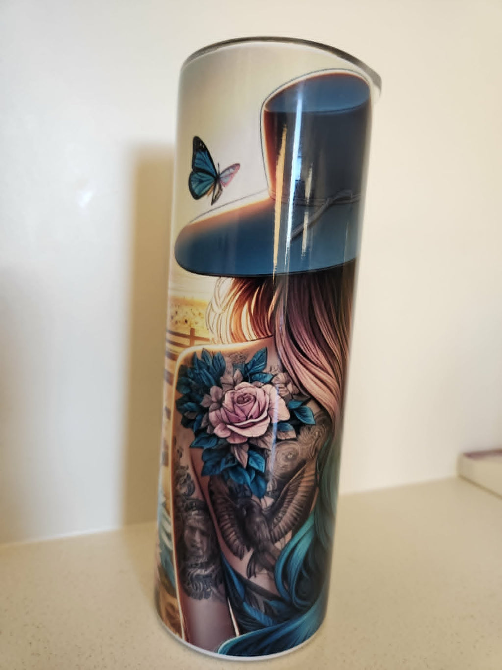 Wild & Free tumbler tattooed woman design side view