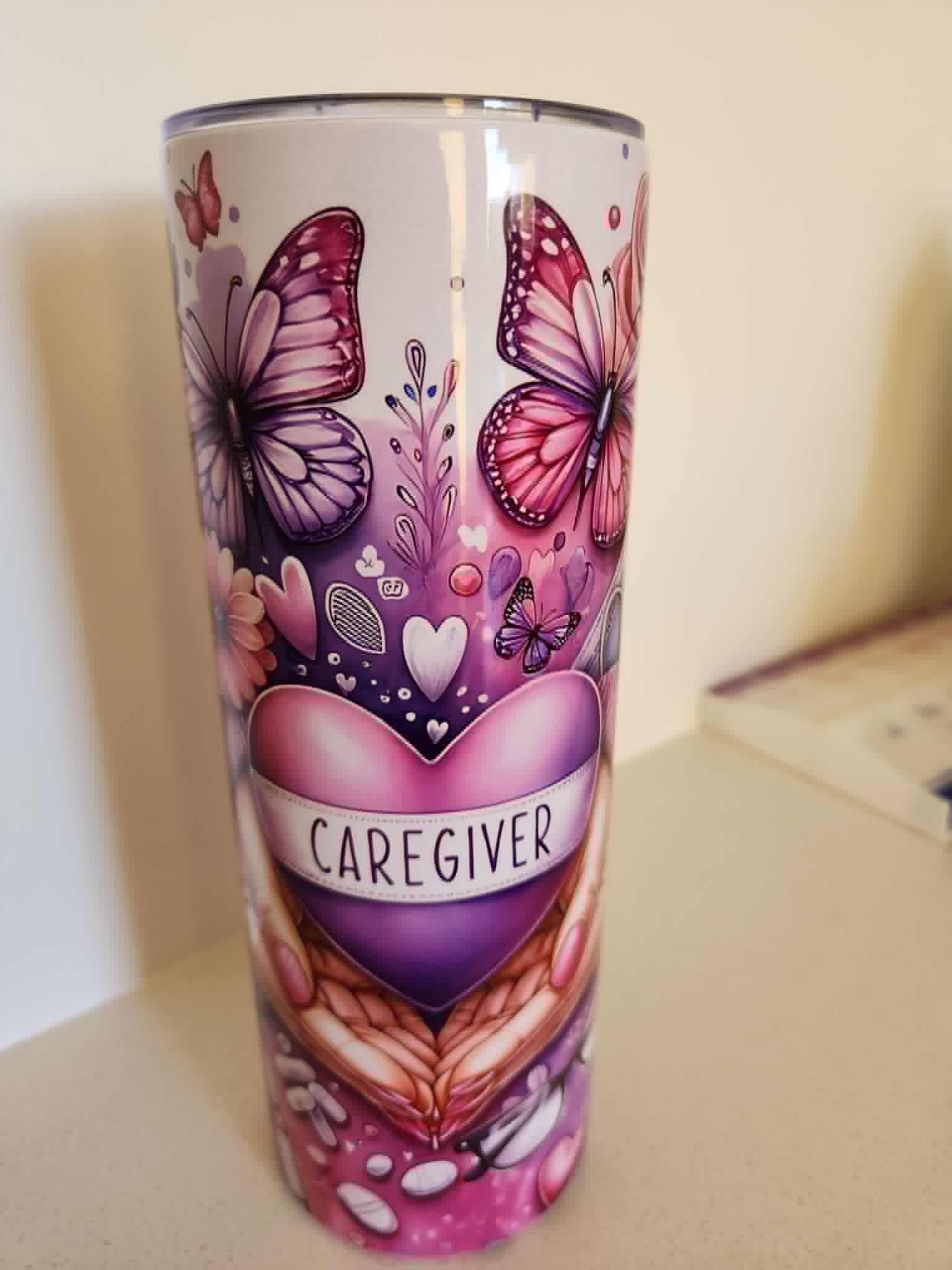 Caregiver tumbler - back view with CAREGIVER heart and butterflies