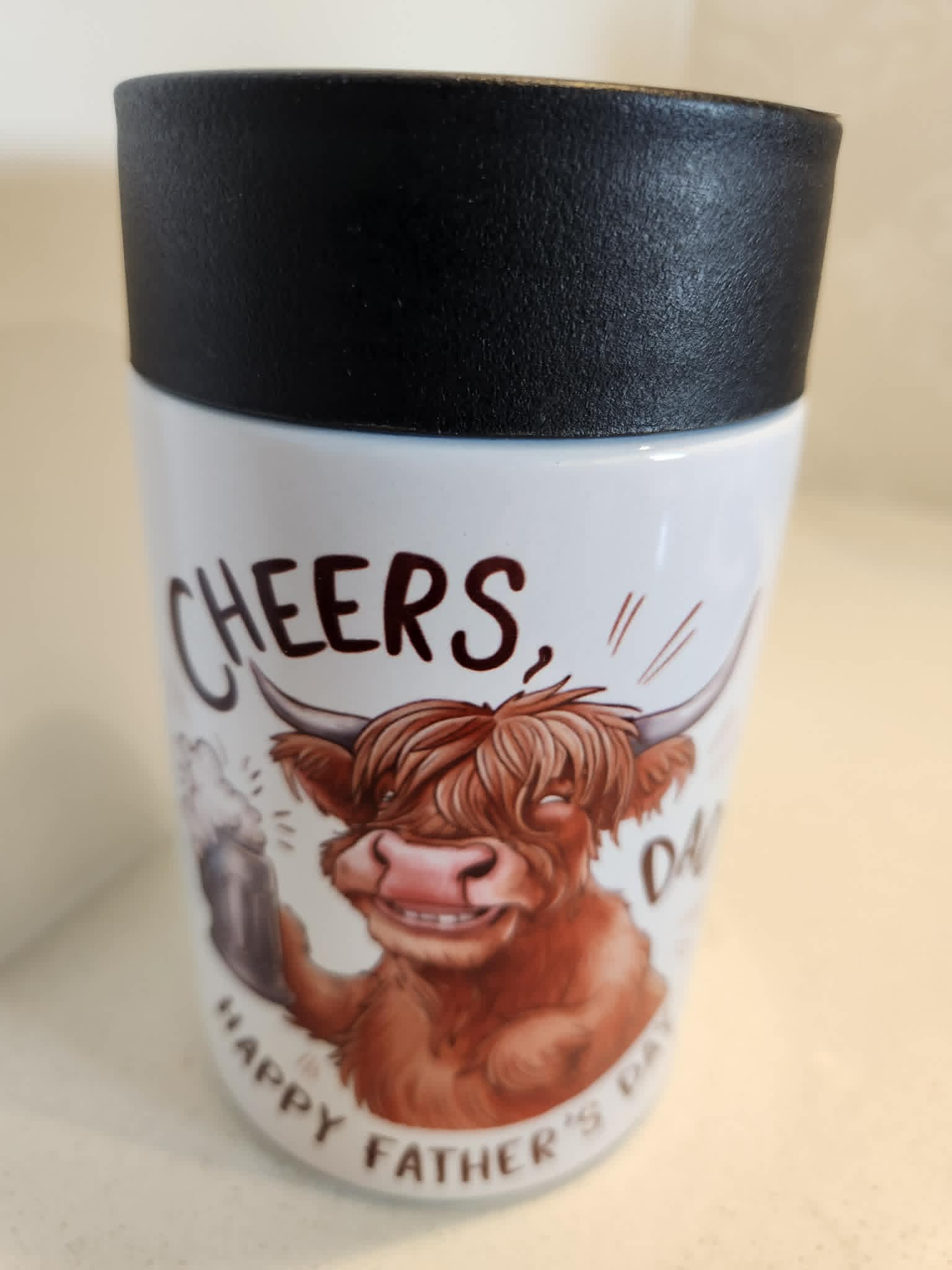 Cheers Dad Father's Day Highland cow can cooler - side view showing full wrap design with Highland cow and text
