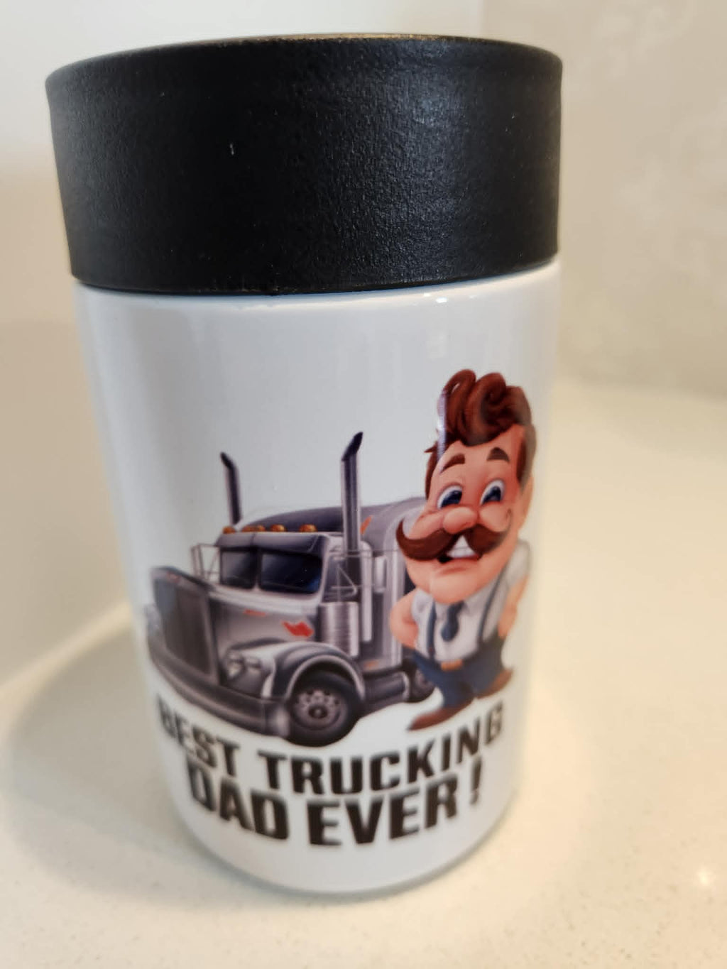 Best Trucking Dad Ever can cooler - side view showing full wrap design with Best Trucking Dad Ever text and semi-truck
