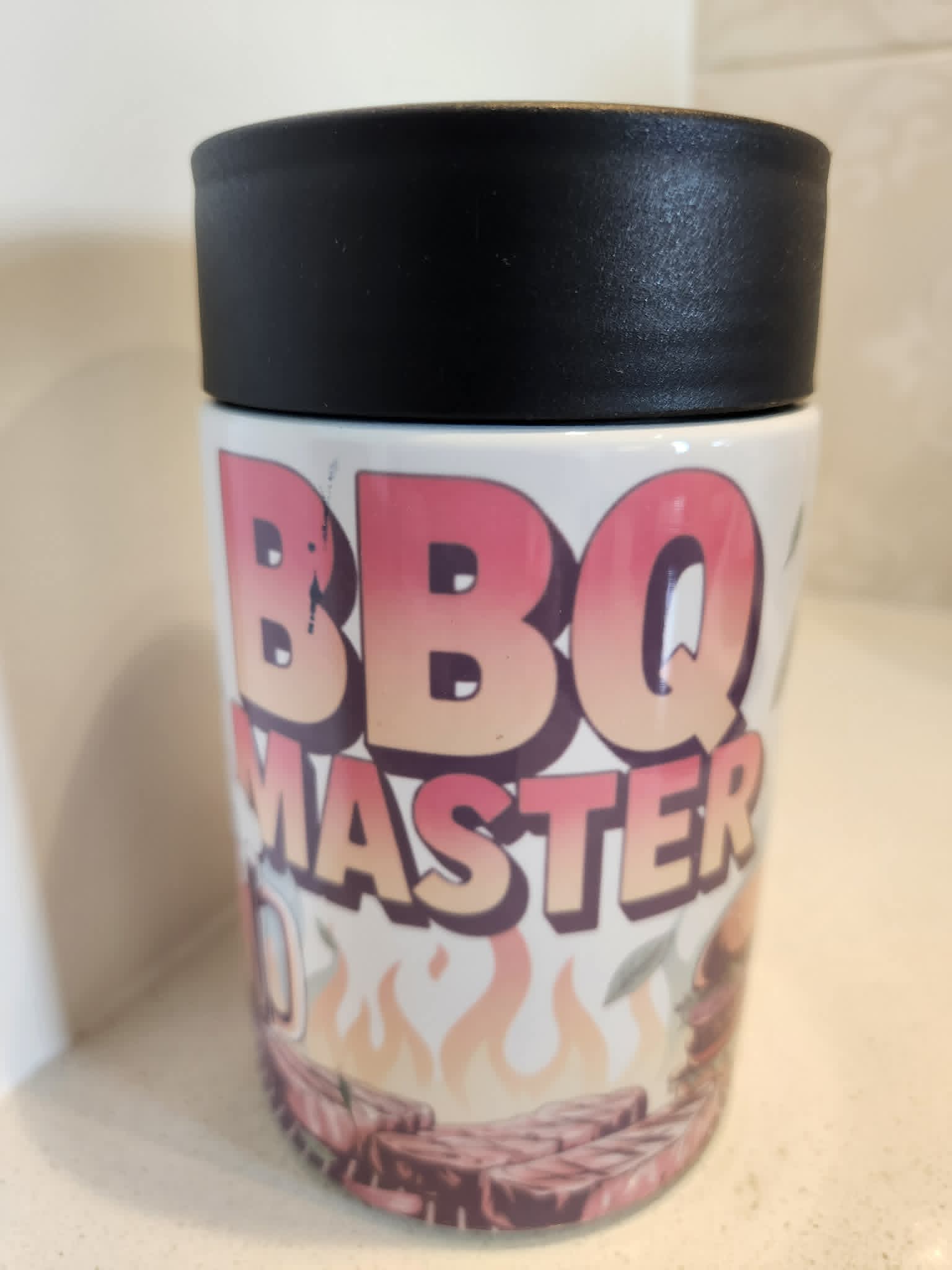BBQ Master can cooler - side view showing full wrap BBQ Master design with flames and meat on white background