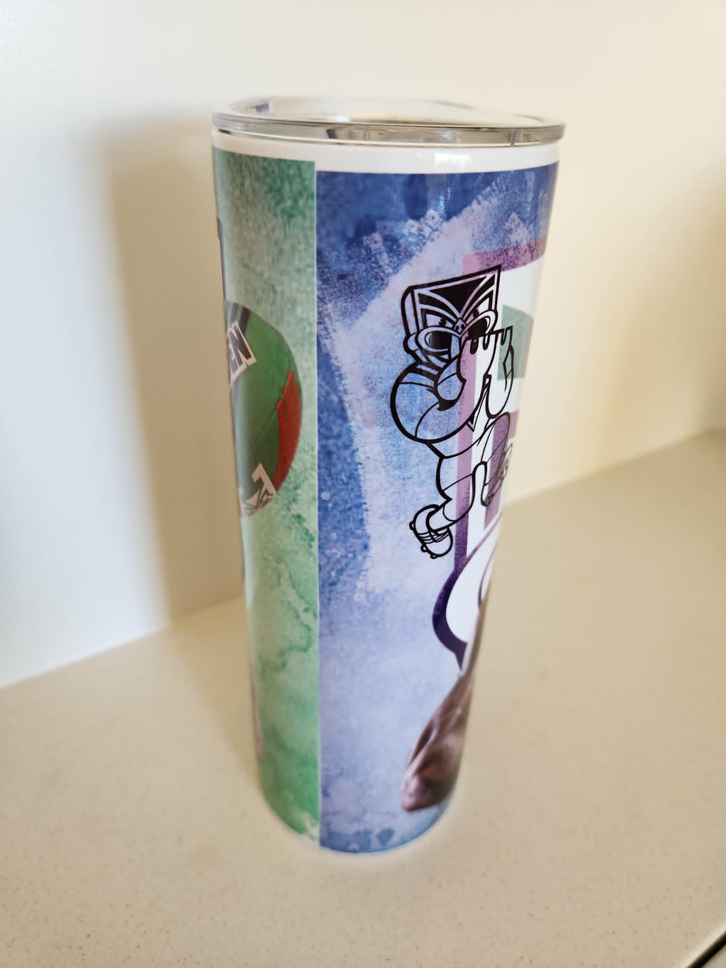 Green Warrior Mascot tumbler - side view with cartoon mascot and footy artwork