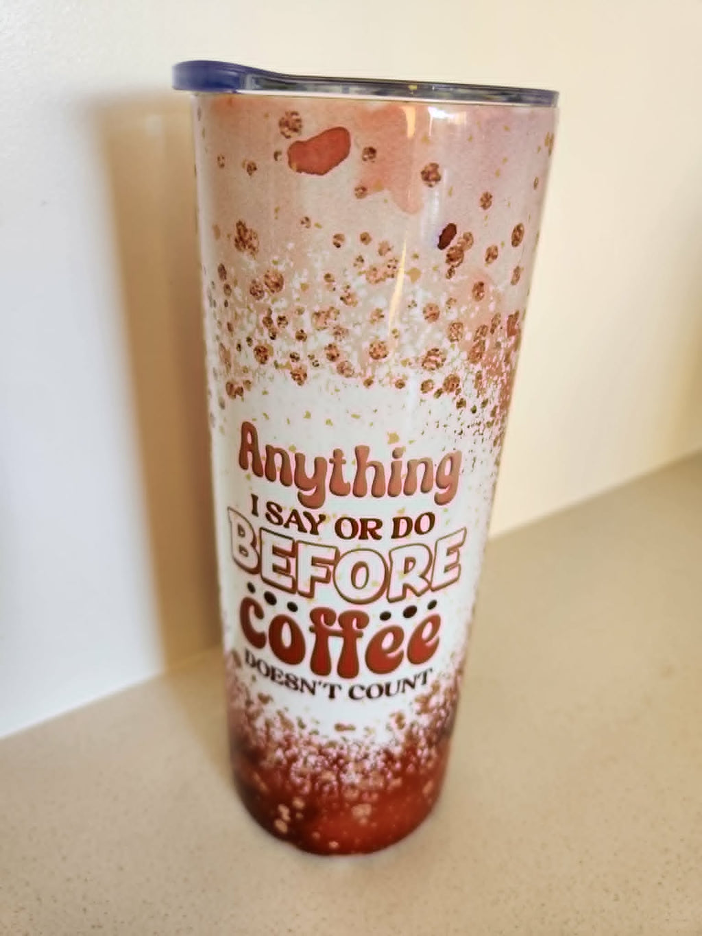 Anything Before Coffee Doesn't Count tumbler - front view with quote and rose gold design