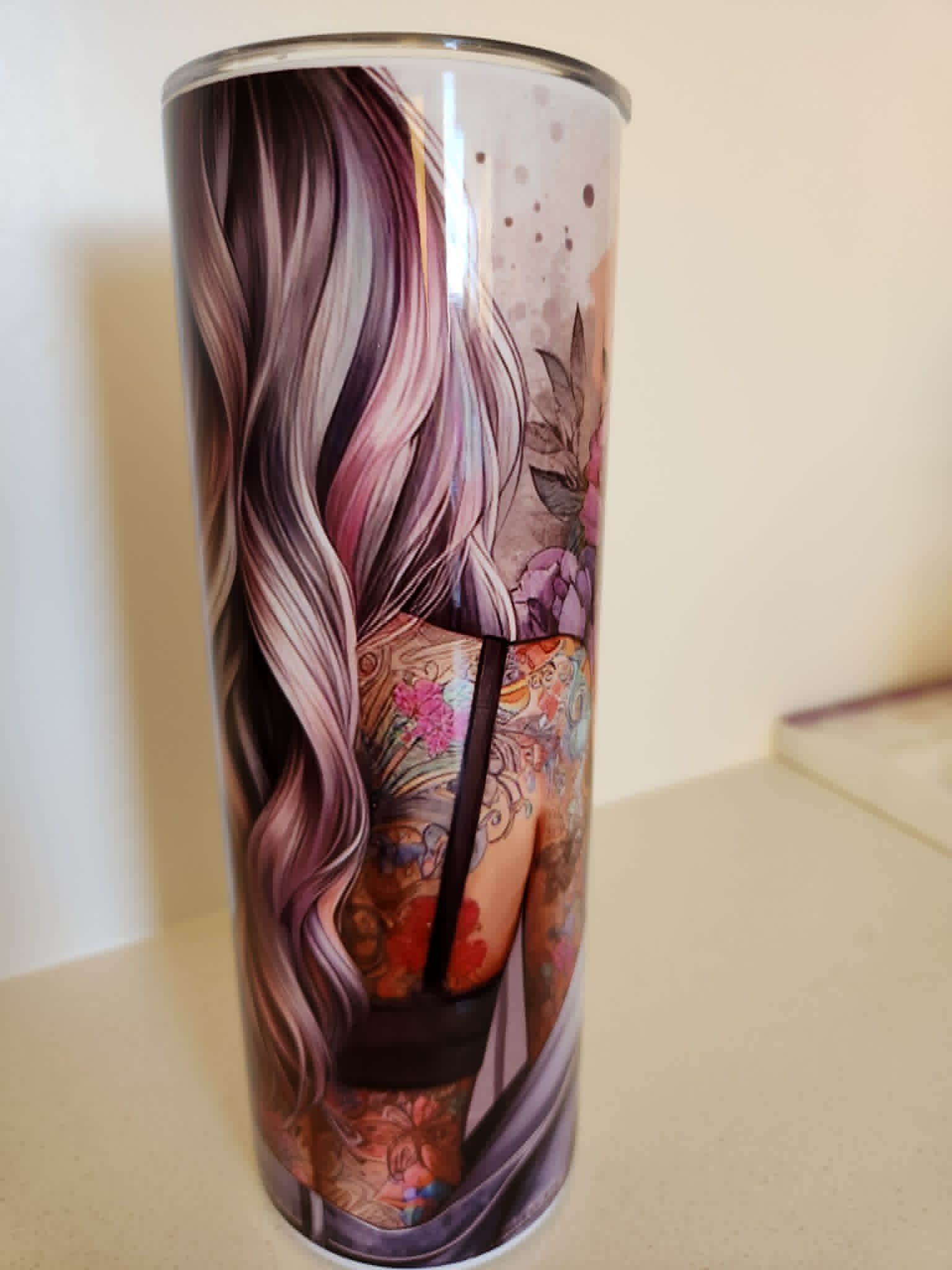 Her Confidence tumbler - back view showing tattooed woman with flowing purple hair