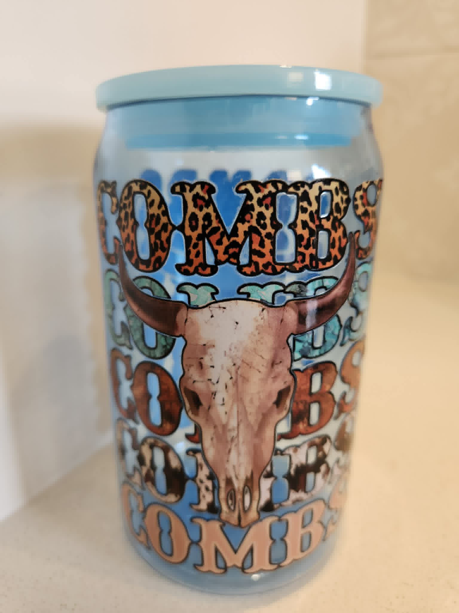 Luke Combs acrylic Libby cup - side view showing full wrap COMBS design with longhorn skull on baby blue background