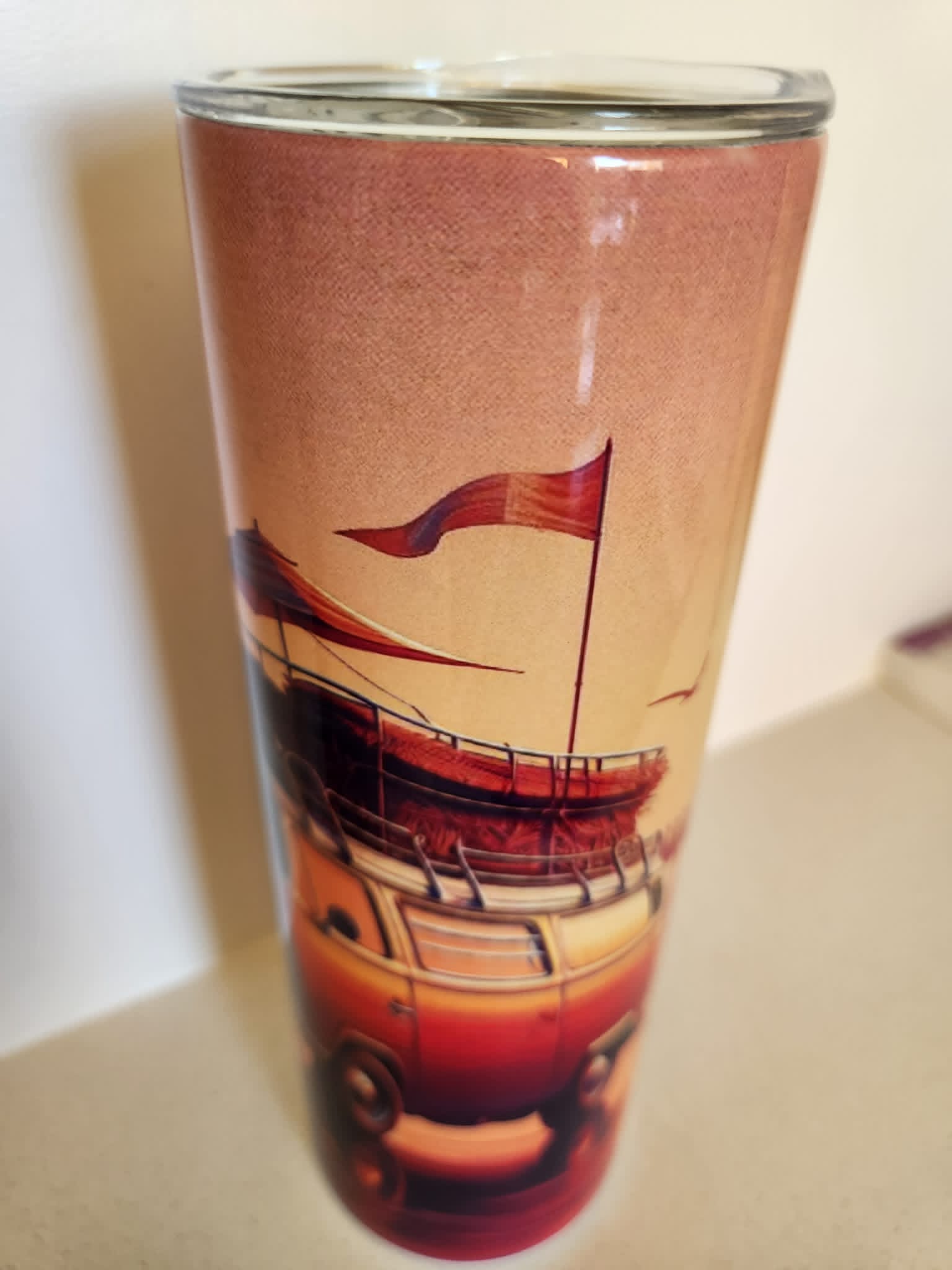 Retro Beach Sunset tumbler - side view with wooden pier and flags at golden hour