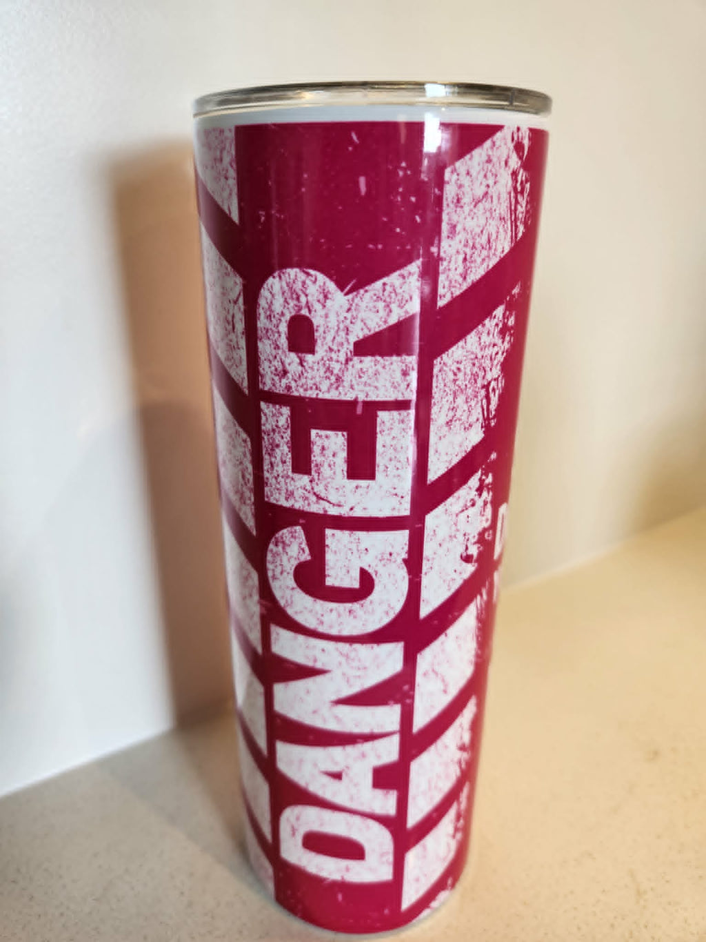 Danger Warning tumbler - front view showing DANGER text in distressed white on magenta