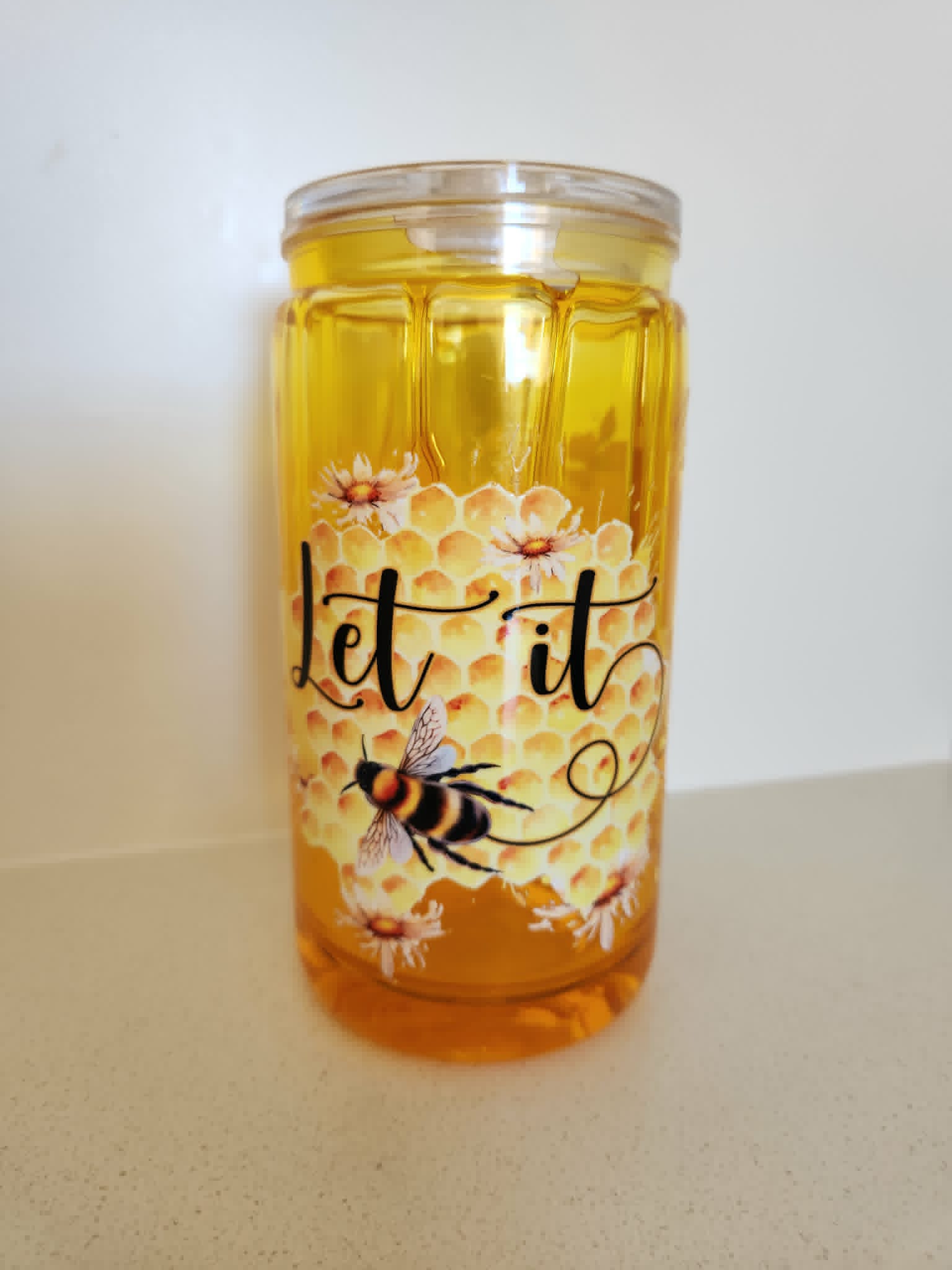 16oz Acrylic Drip Snow Globe - Let It Bee honeycomb and daisy design front view