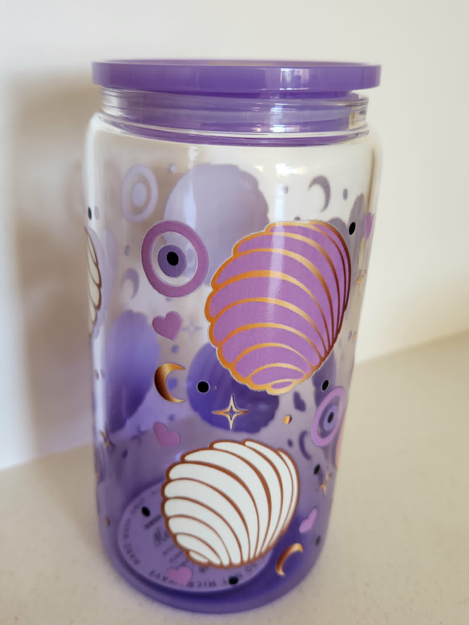 16oz Glass Libby Cup - Purple shell and evil eye design back view with gold shells