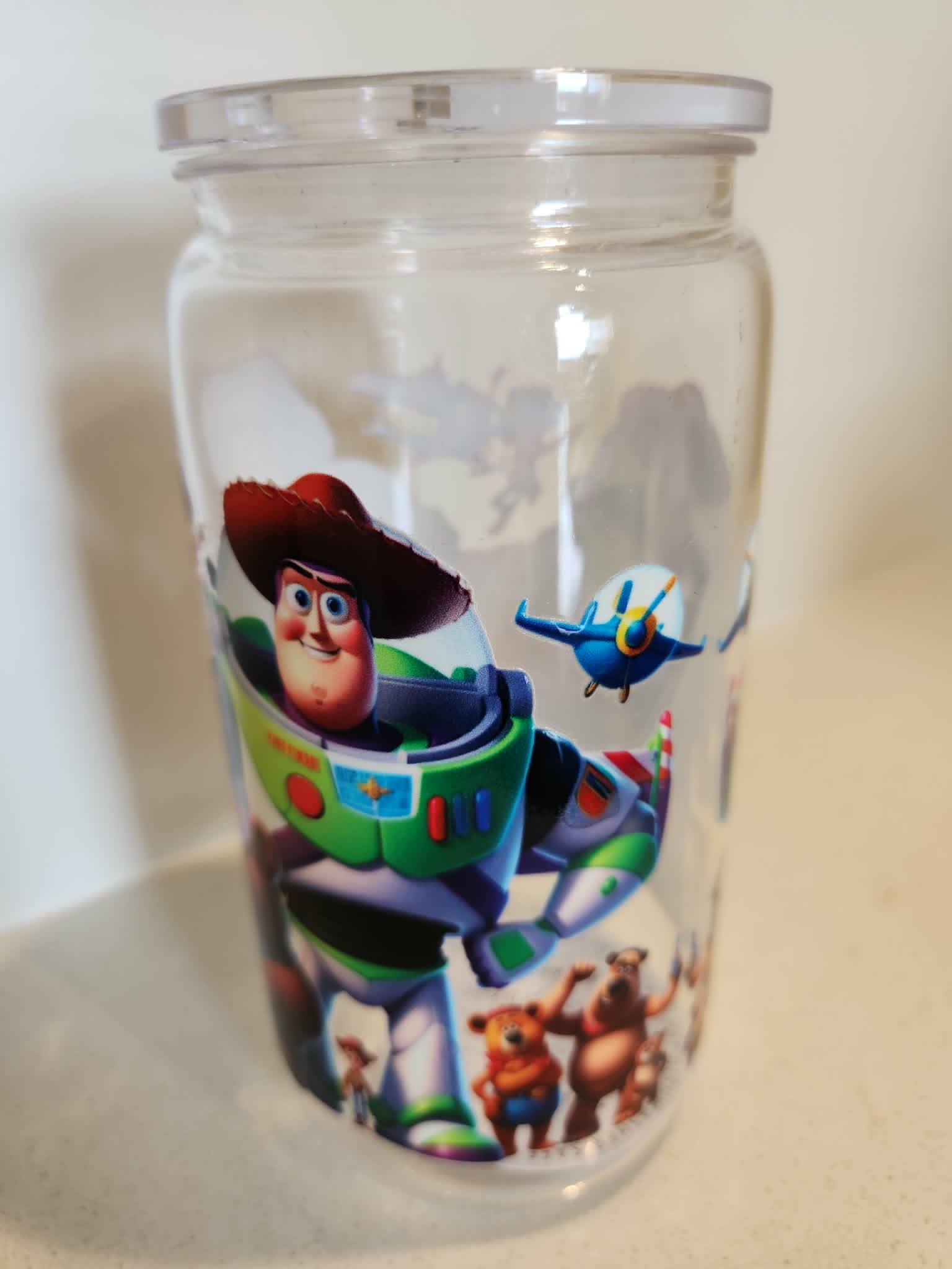 Toy Story acrylic Libby cup - side view showing Buzz Lightyear in action pose with Lotso Bear