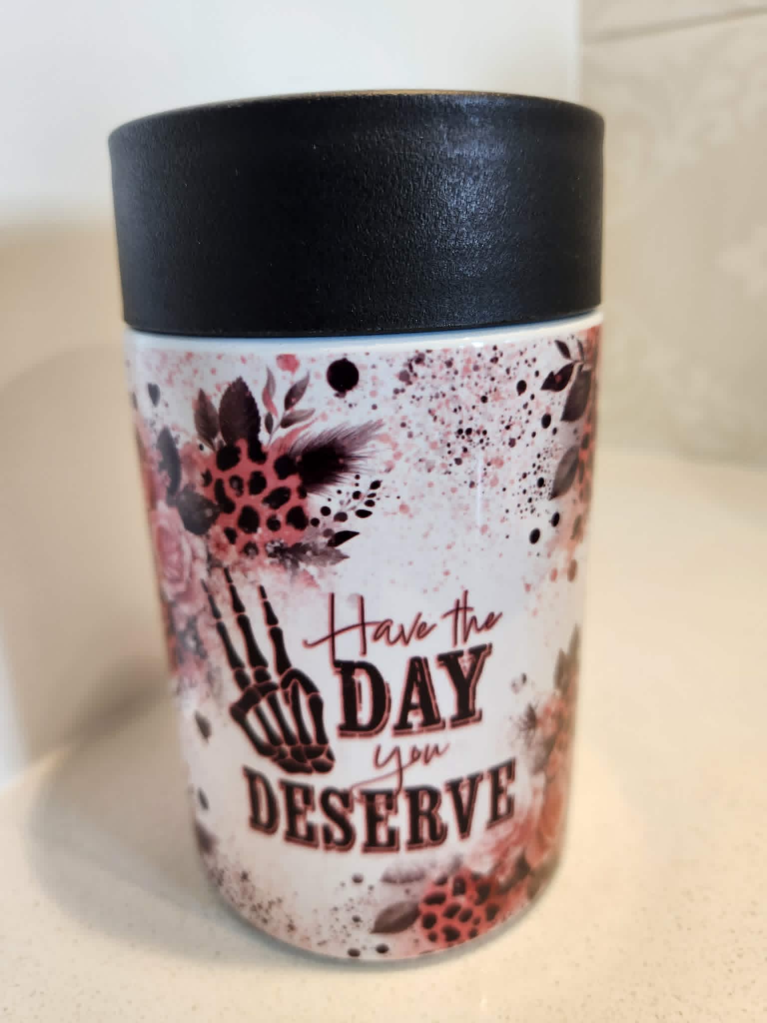 Have The Day You Deserve can cooler - side view showing full wrap floral skeleton design with leopard print and ink splatter