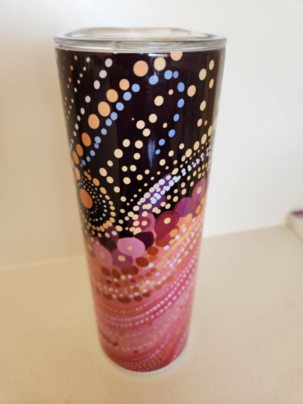Dreamtime Dots tumbler - side view with flowing pink and mauve dot patterns