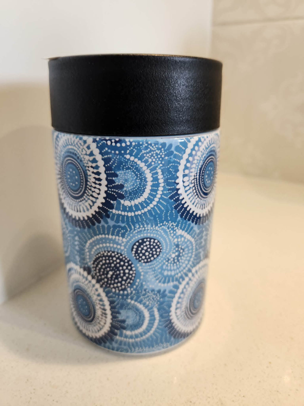 Aboriginal dot art blue can cooler - side view showing full wrap Indigenous dot art pattern in blue tones
