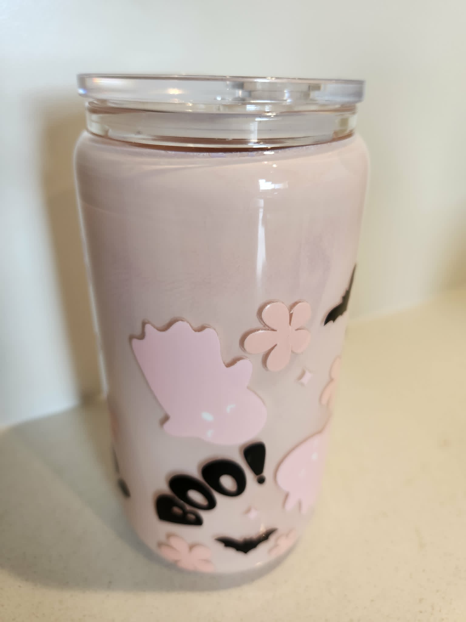 BOO Pink Ghost snow globe glass Libby cup - side view showing pink ghosts and flowers on blush background