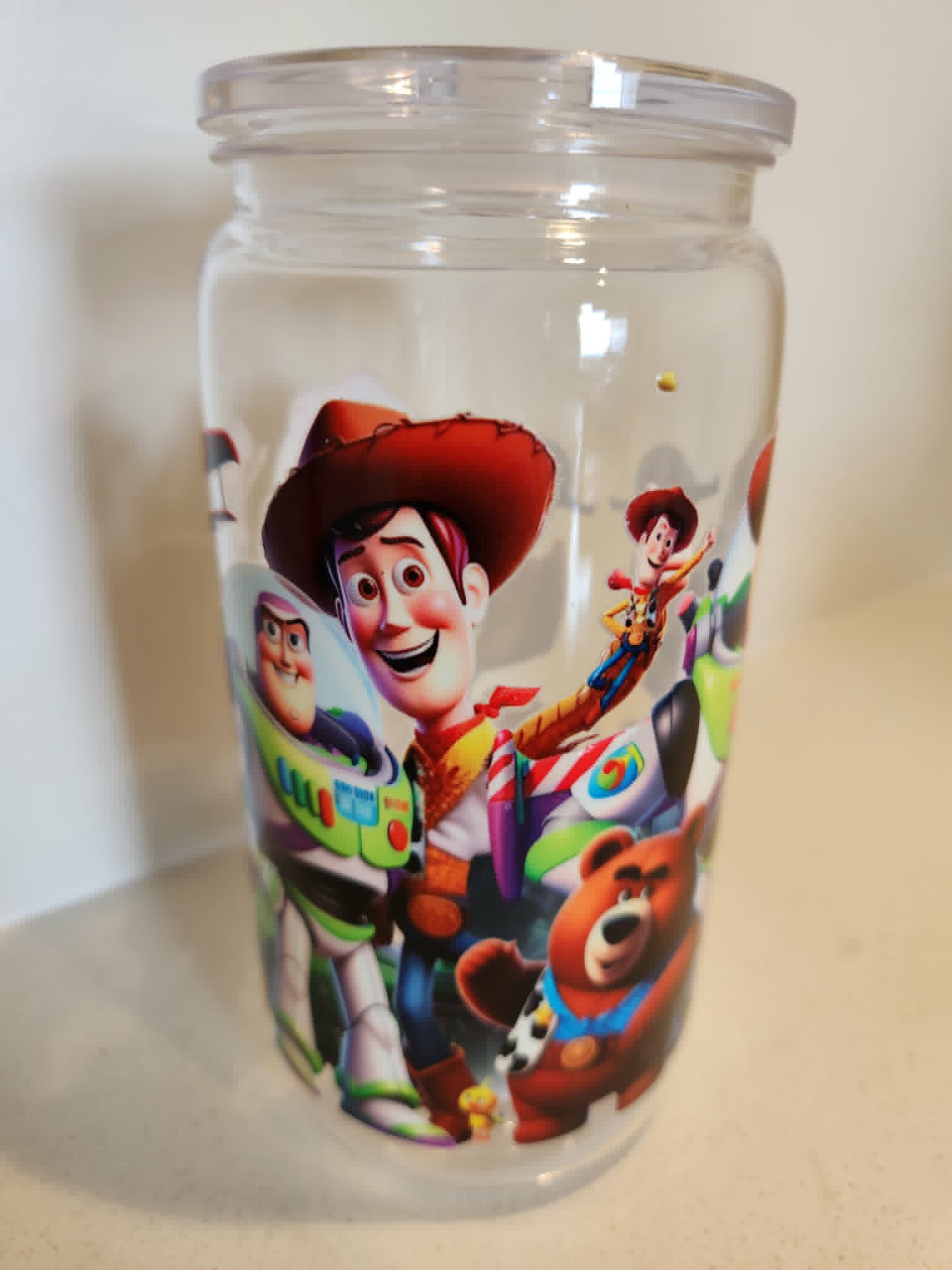 Toy Story acrylic Libby cup - front view showing Woody and Buzz Lightyear with Lotso Bear