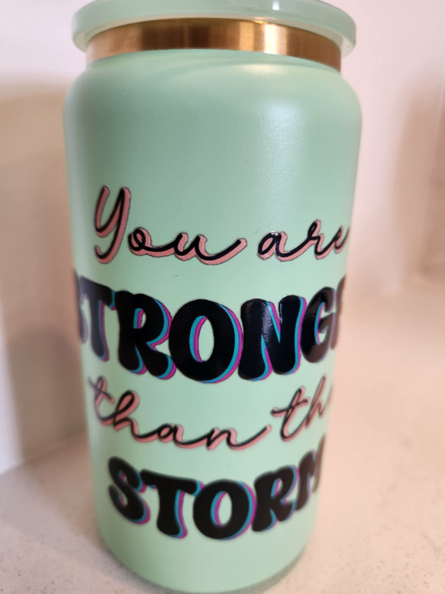 You Are Stronger Than The Storm stainless steel Libby cup - back view showing empowering quote in bold black lettering